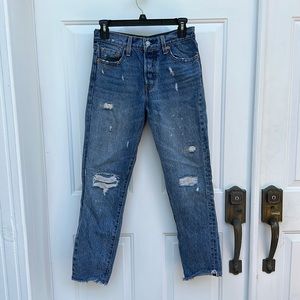 Distressed slim fit Levi’s jeans (not sure exact type)